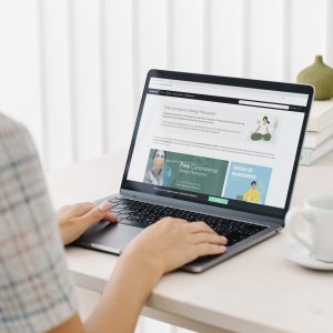 Home woman checking out free design resources at a website